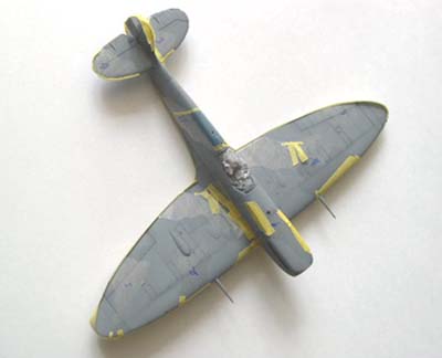 painting masks on scale model spitfire